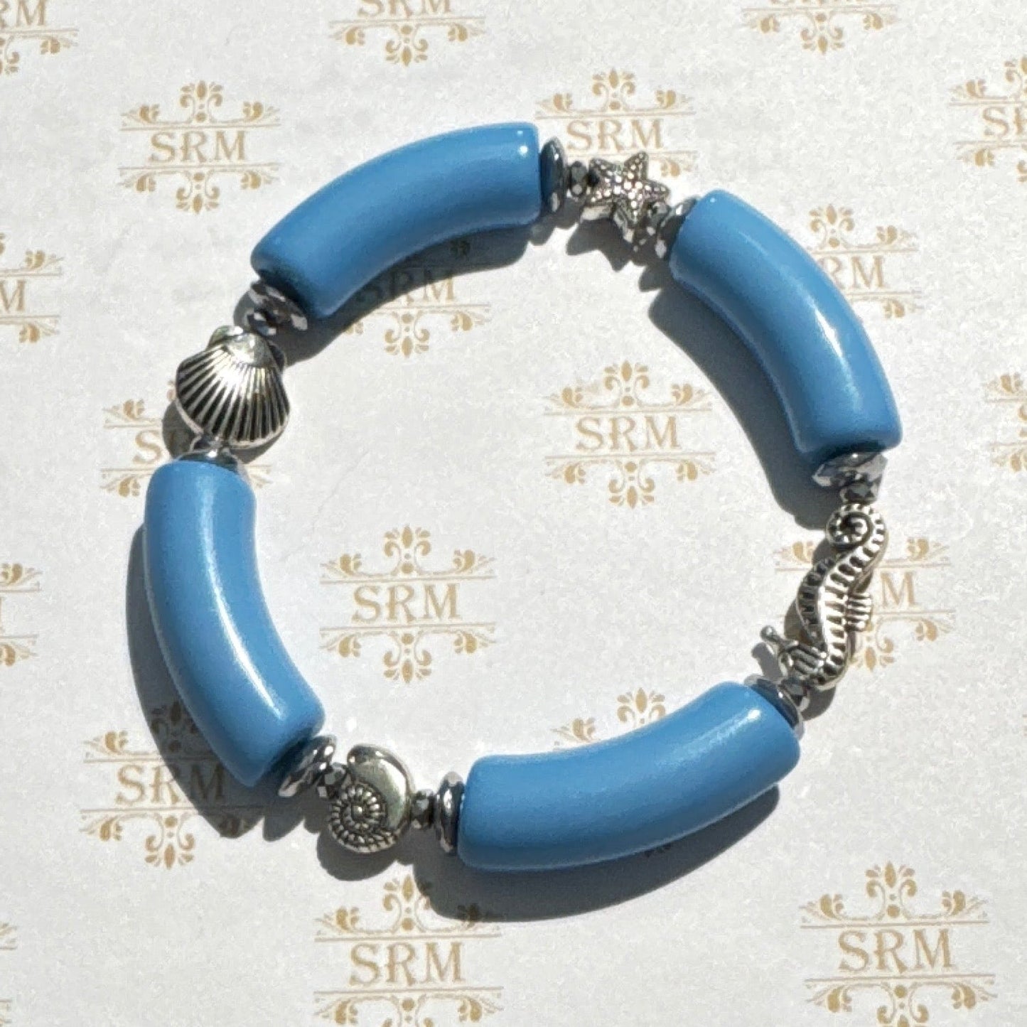 Bracelet : 'Mermaid' Blue Lucite, Silver Metal Sea Creatures and Hematite, 7"+