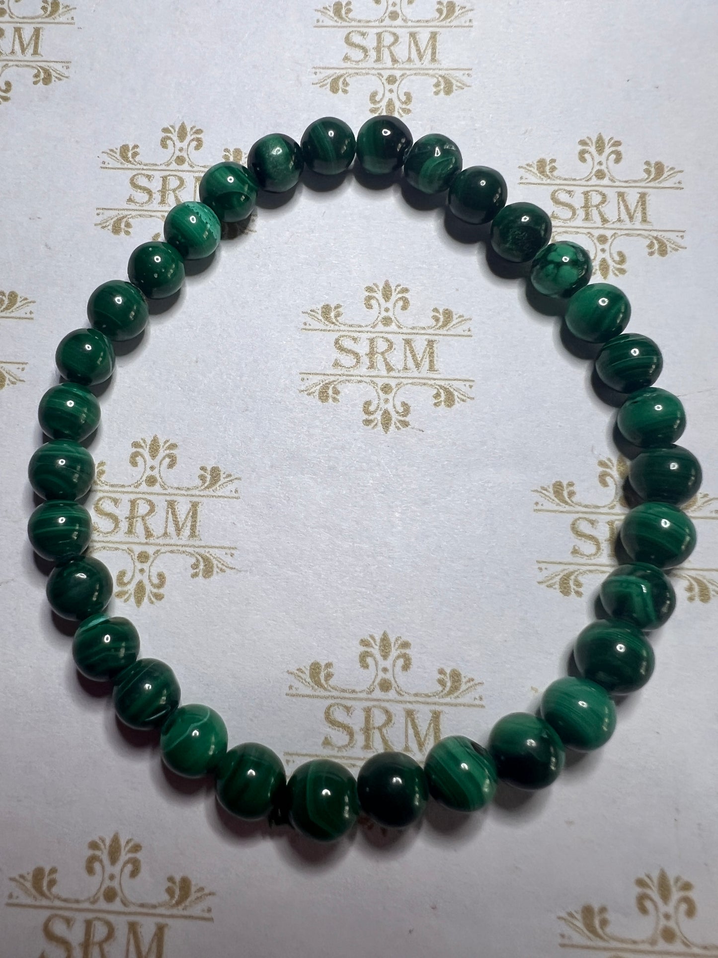 Bracelet : 6mm Malachite. 6¾”.