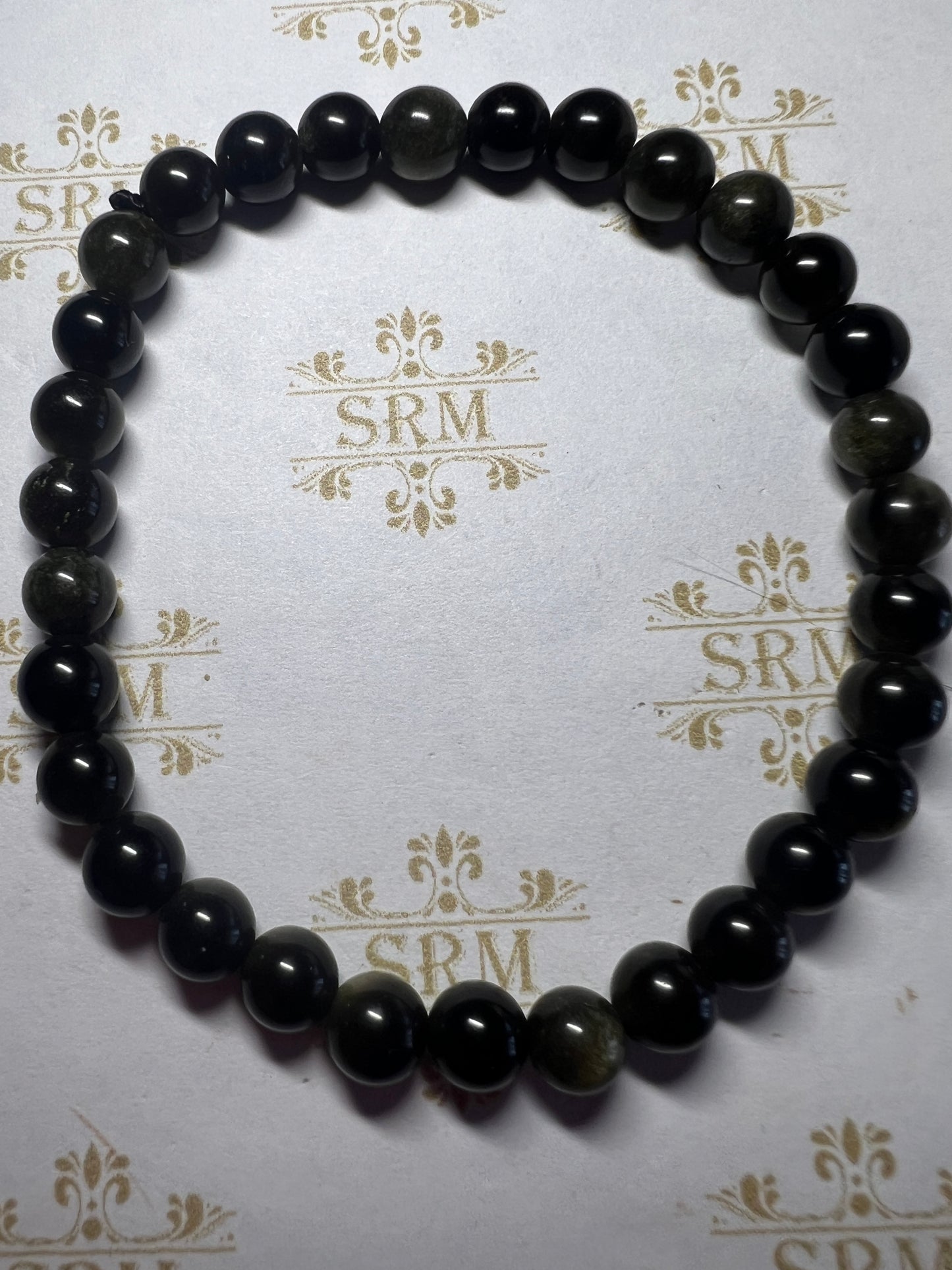 Bracelet : 6mm Golden Sheen Obsidian , 6½".