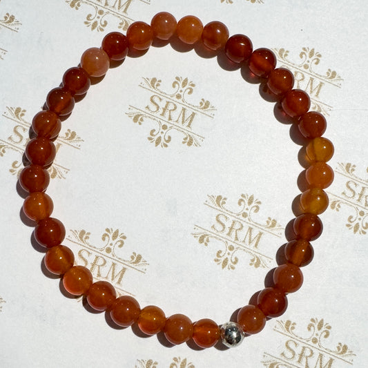 Bracelet : 6mm Carnelian with a Silver-plated bead, 6¾"